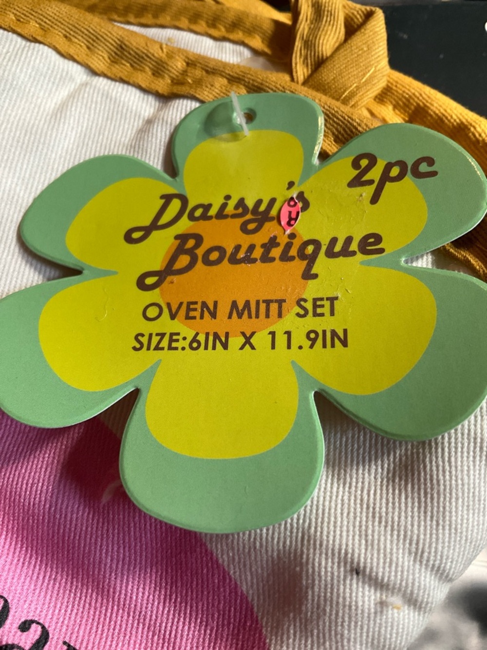 "Snaccident" oven mitt set from the Daisy Boutique Brand Pink and Yellow - Picture 4 of 7